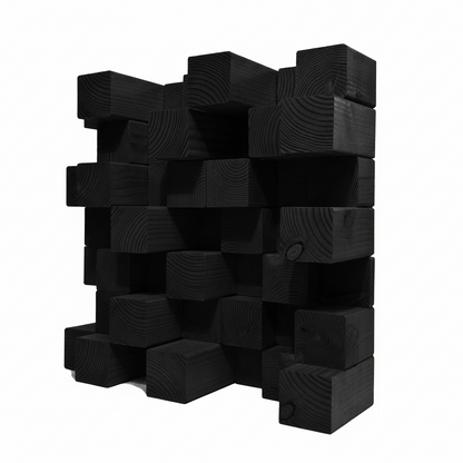 A black acoustic diffuser made of stacked rectangular black wood blocks with visible grain patterns, set against a solid white background.